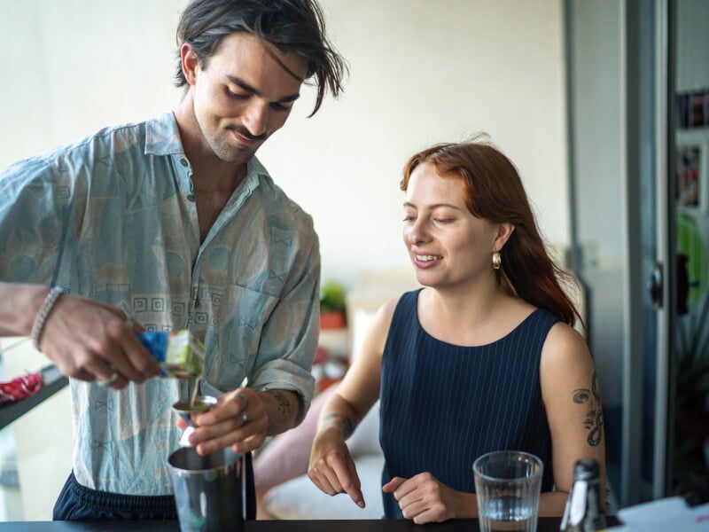 couples making cocktails at home